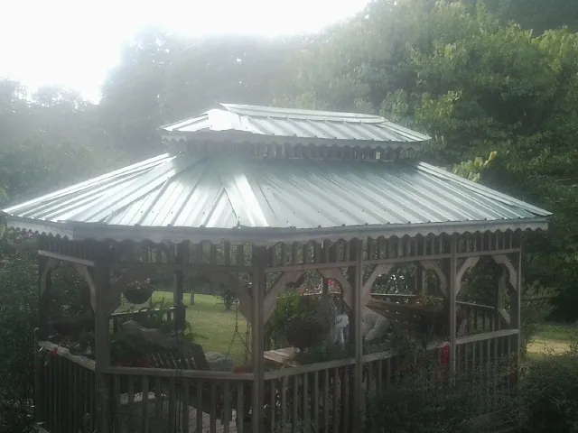 Two tier green metal roof on a garden gazebo in Dandridge